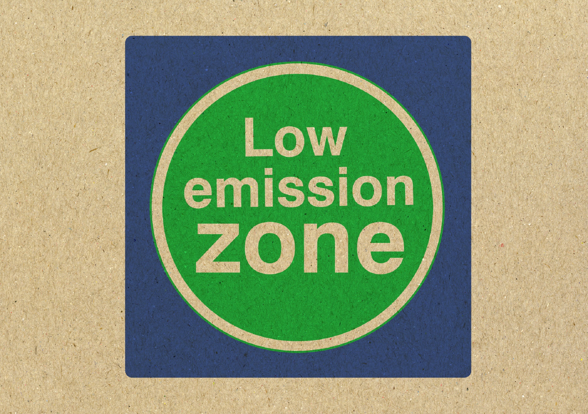 Cardboard sign saying ‘low emission zone’.