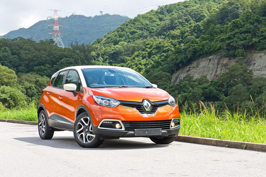 a Renault Captur compact SUV driving through countryside