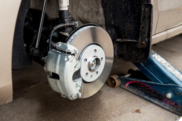 the tyres off a car to reveal the brakes